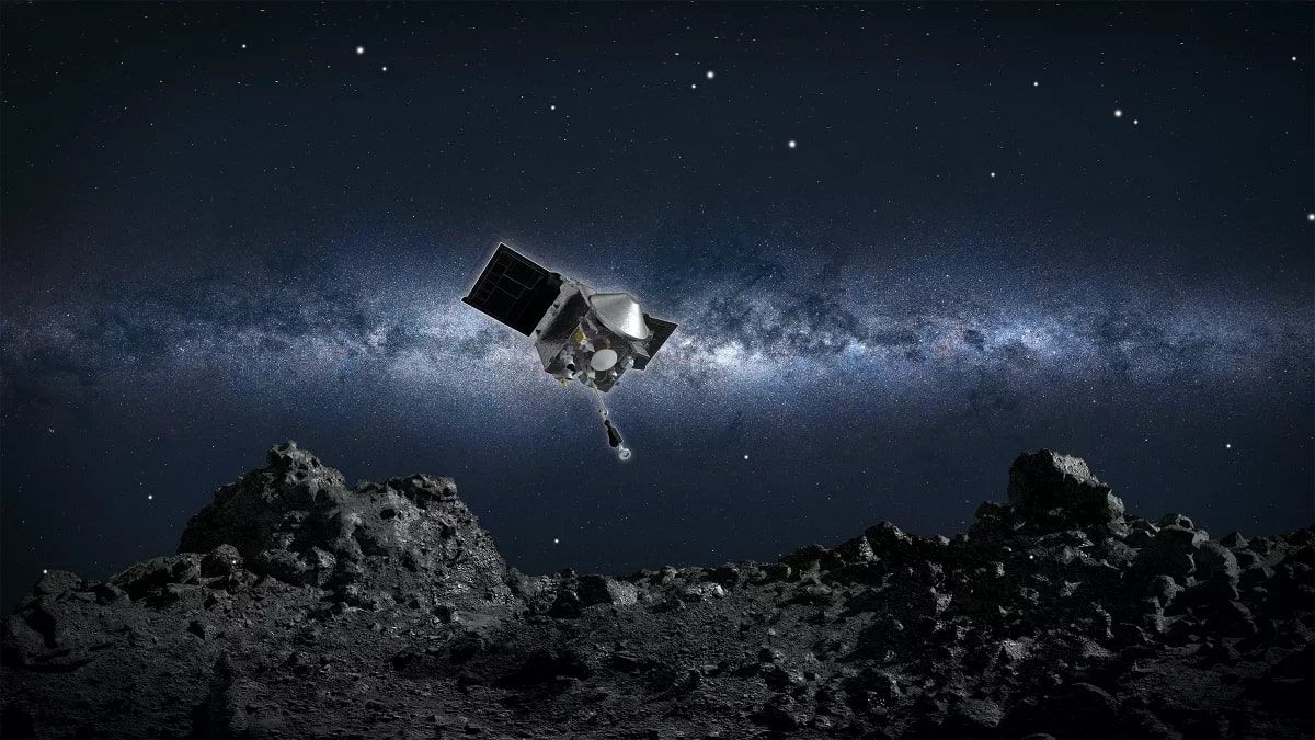 An artist's illustration of the OSIRIS-REx spacecraft as it poised to land on the asteroid Bennu.