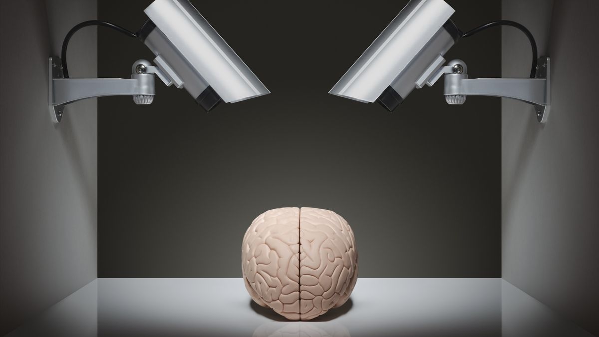 An illustration with two security cameras pointed at a brain on a table