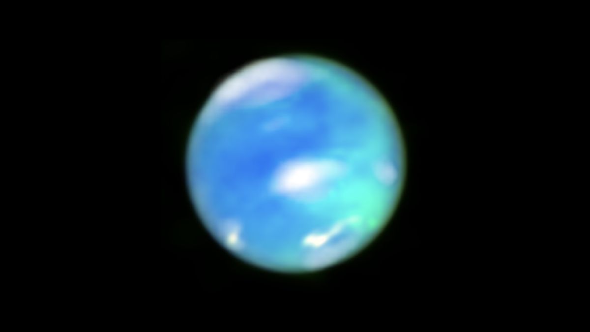 A blurry image of Neptune with cyan-colored cloudy shapes on its surface