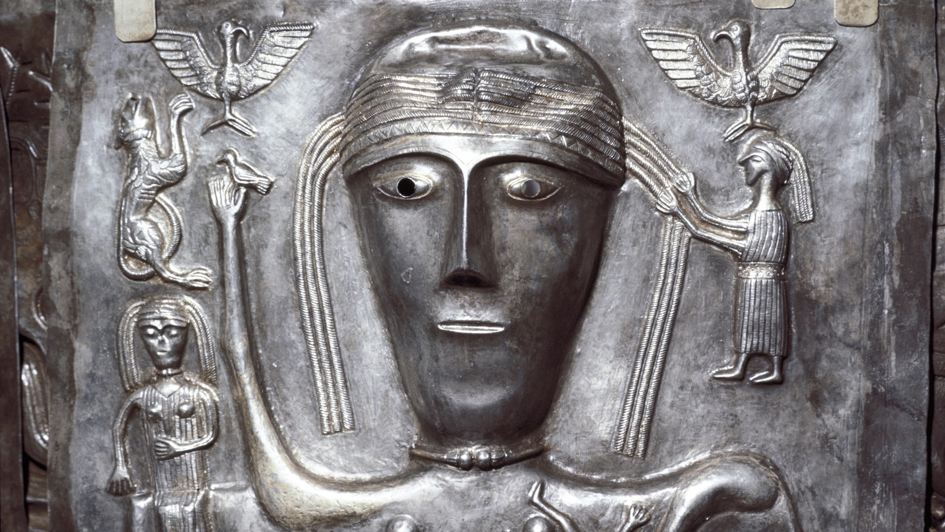 An iron cauldron with a goddess depicted on it