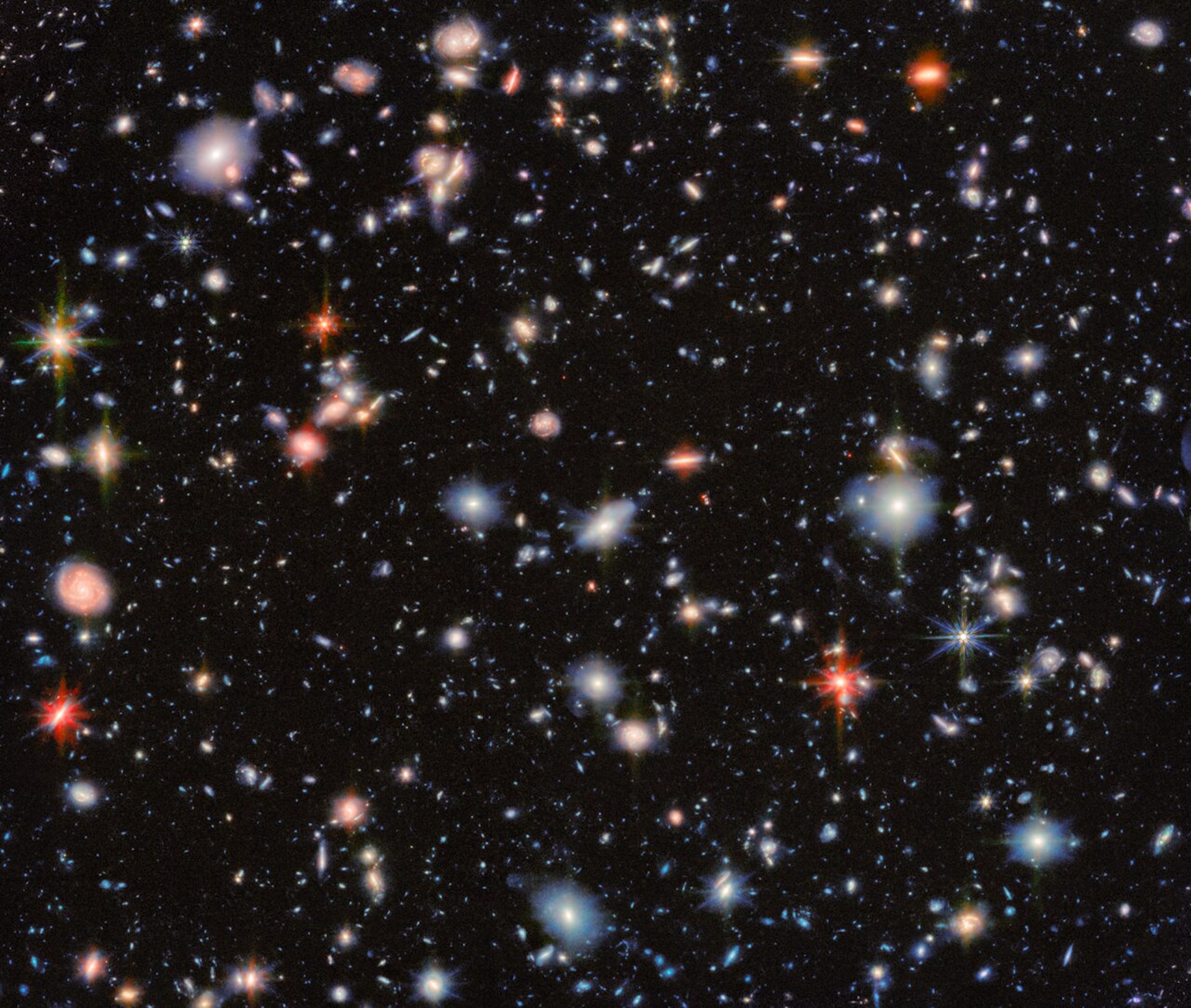a deep field image showing many galaxies and stars