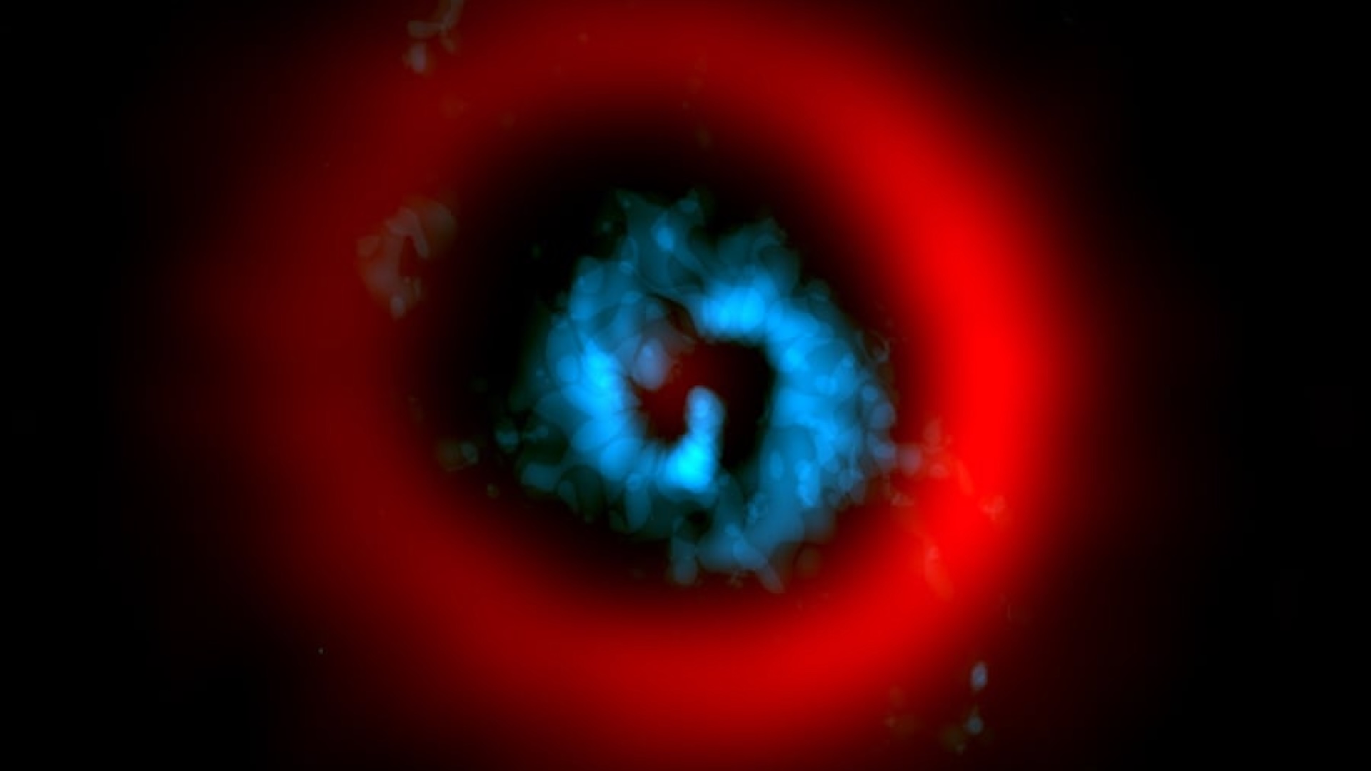 An image of a blue swirl with a red halo around it in outer space