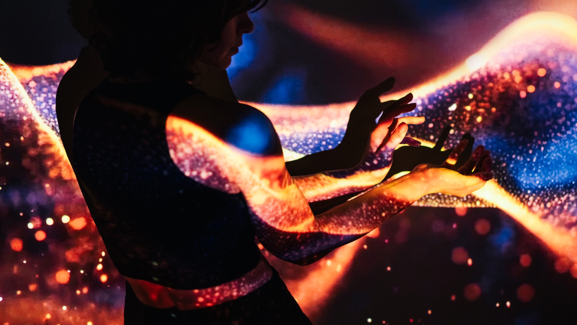 a woman in colorful psychedelic lighting