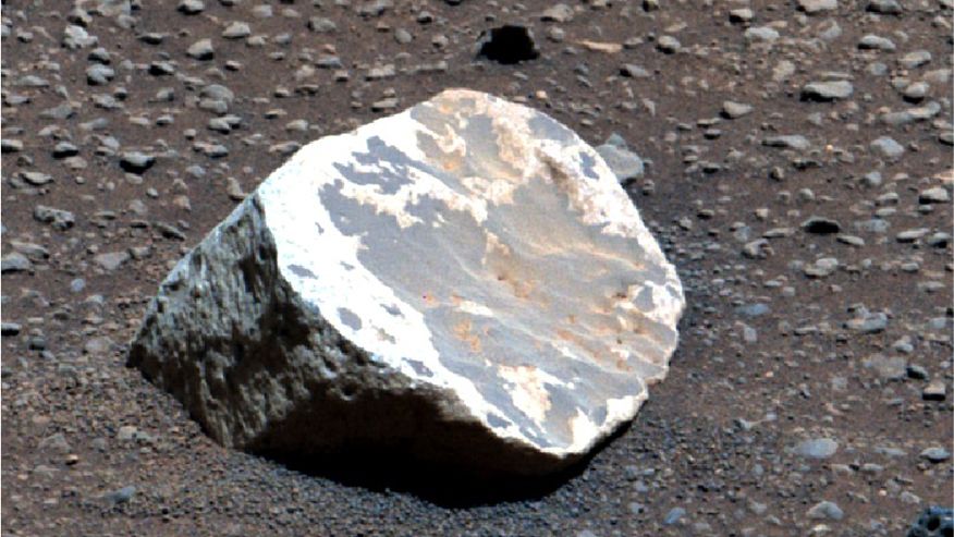 A bleached white boulder on Mars