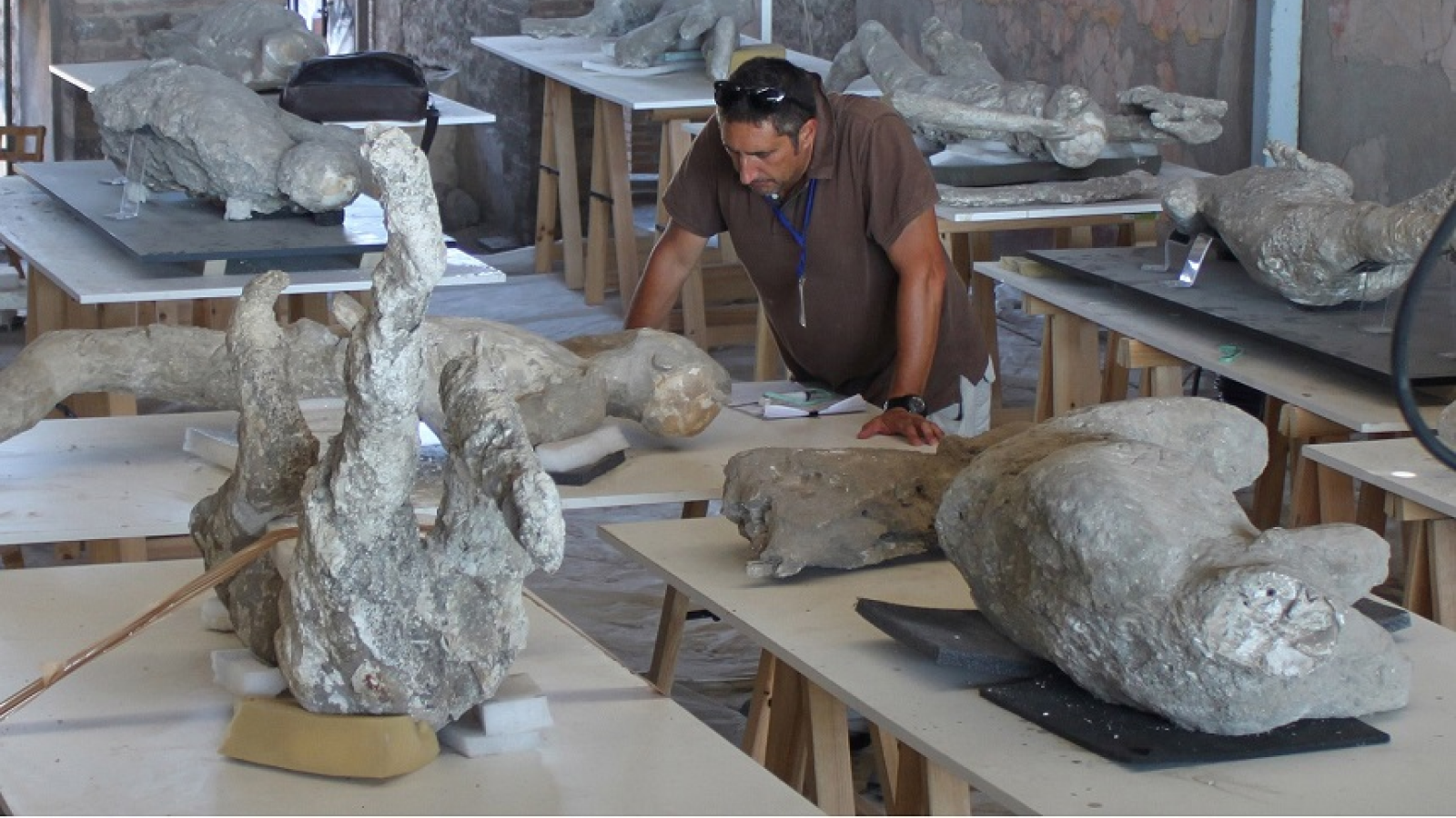 Archeologist Llorenç Alapont among some of the plaster casts of the victims at Pompeii.