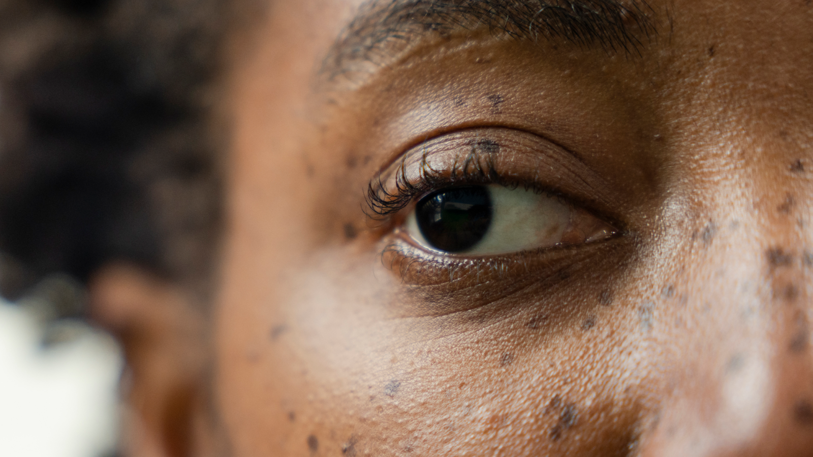Close-up of woman face while looking away.