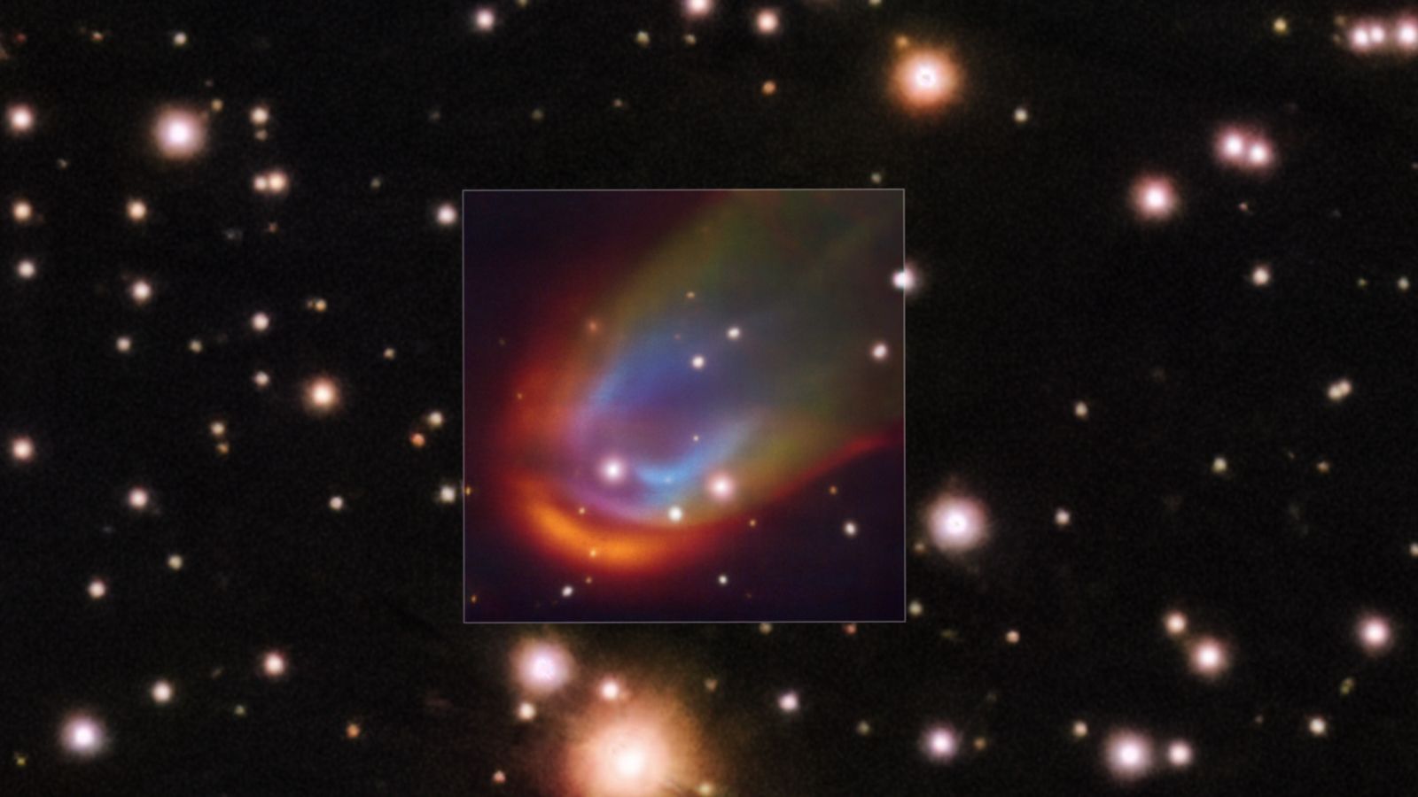 Image showing a multicolored bow shock surrounding a distant star