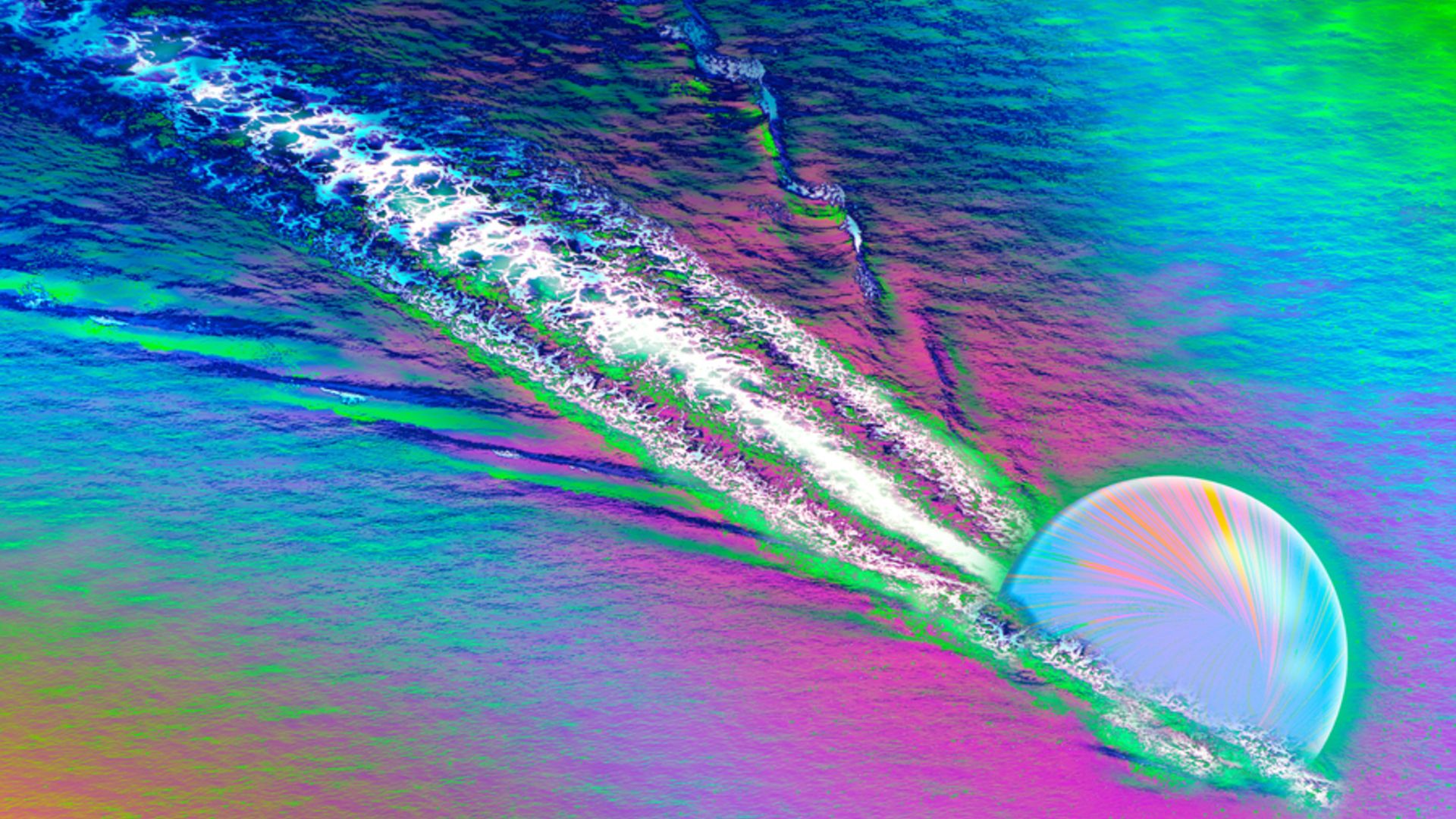 A colorful image shows a opalescent sphere carving a streak through a rainbow colored surface, kicking up white streaks behind it
