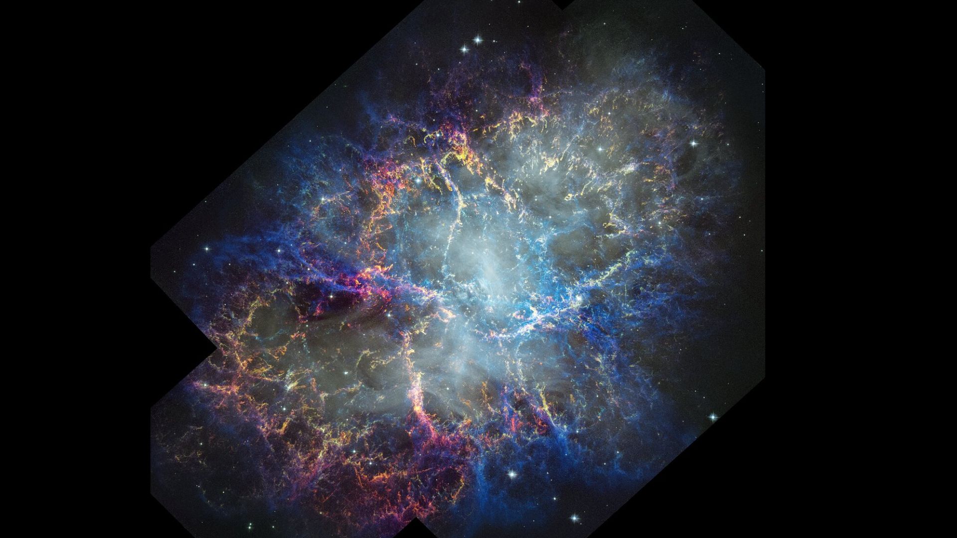 Une nébuleuse brillante de rose, de bleu et d'orange est visible dans l'obscurité de l'espace