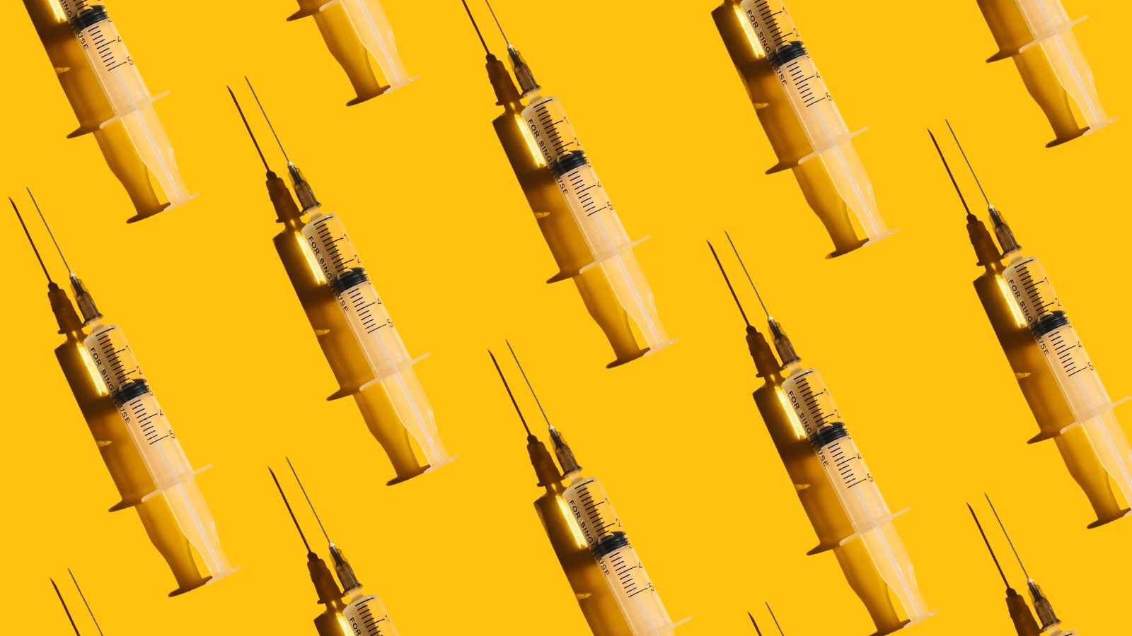 Pattern of syringes with a vaccine on yellow background. Concept of medical treatment or vaccination.