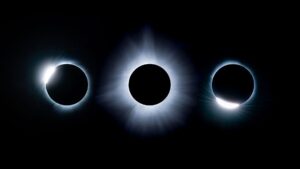 Composite view showing three images of the phases of a solar eclipse next to one another: totality is seen in the middle and the diamond ring stages on either side.