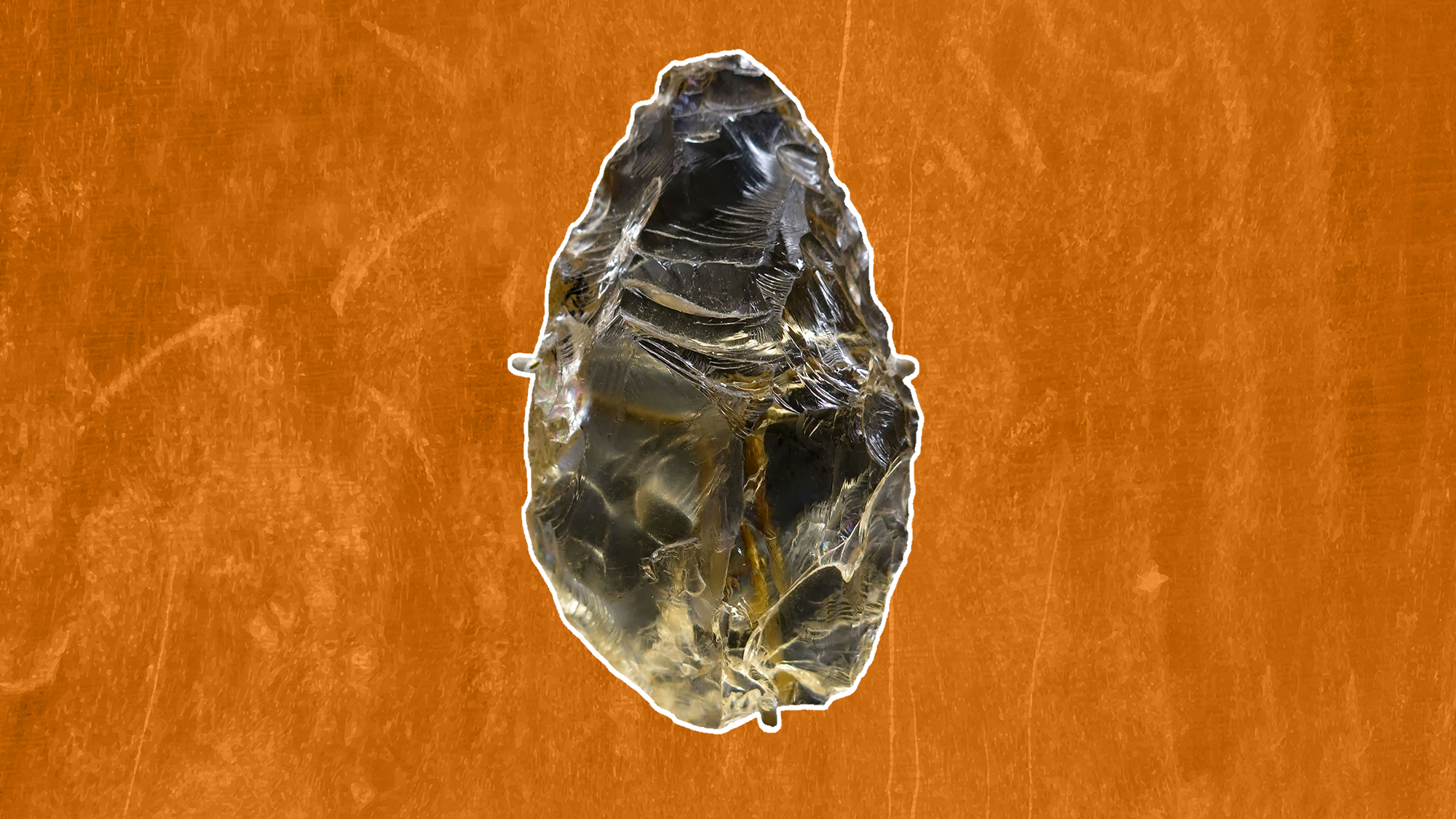 un grattoir à cristal sur fond orange