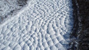 Aerial image showing a bumpy landscape caused by melting permafrost in eastern Siberia.