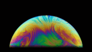 A gif showing colorful fluid moving in a bubble