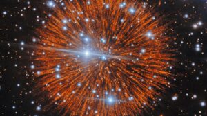 A glowing ball with orange streaks is seen in deep space